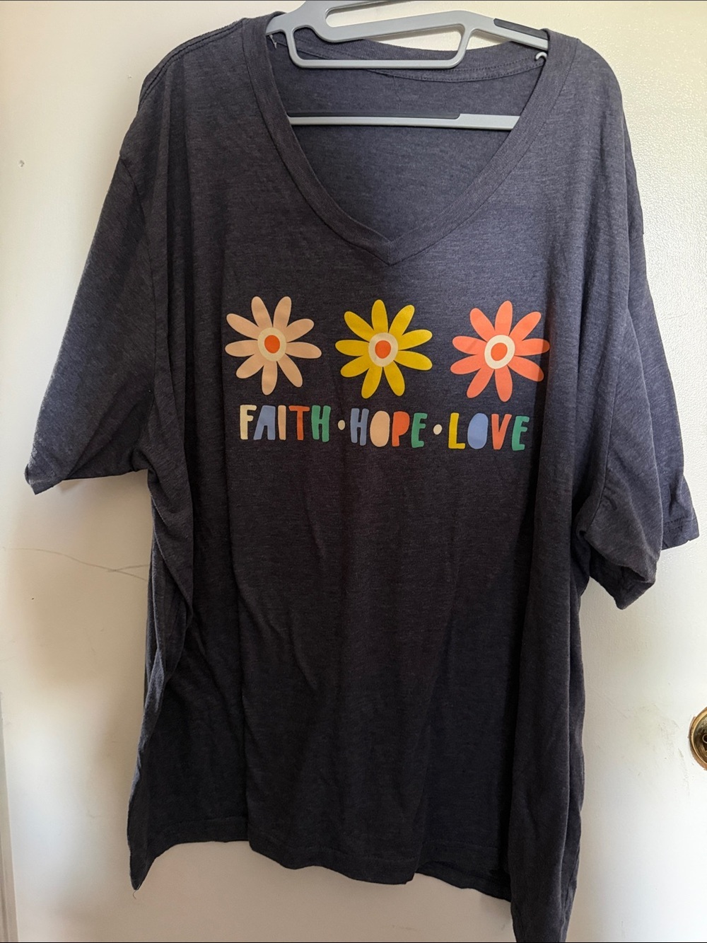 Love in Faith heathered navy 4X V-Neck Tee with Colorful Daisy Graphics